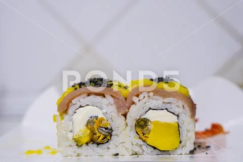 Sushi rolls Asian cuisine food photography rustic kitchen white wall blurred Stock-Fotos