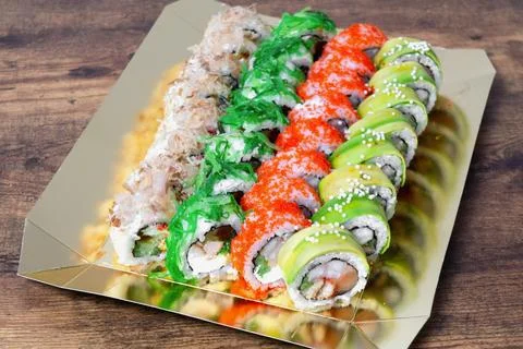 Sushi rolls on the  background. Different fresh sushi rolls. Japanese sushi.. Stock Photos