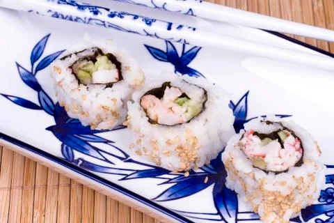 Sushi rolls on ceramic dishware Stock Photos