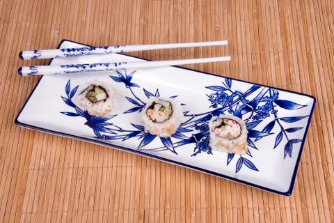 Sushi rolls on ceramic dishware Stock Photos