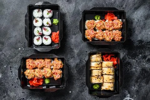 The sushi rolls in the delivery package, ordered in sushi take-out restaurant Stock Photos