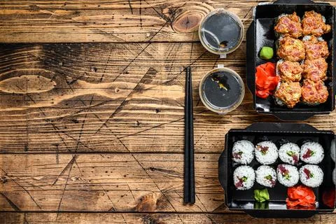 The sushi rolls in the delivery package, ordered in sushi take-out restaurant Stock Photos