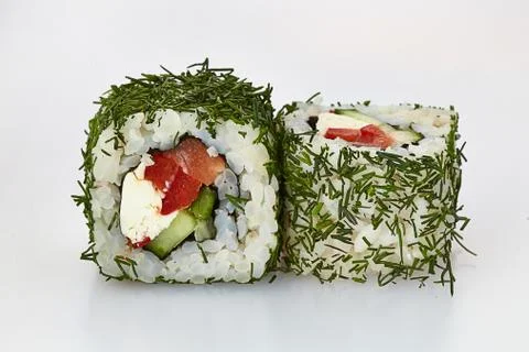 Sushi rolls in dill on a white background Stock Photos