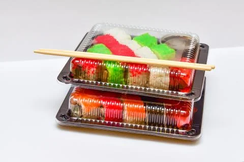 Sushi rolls pack in plastic container on white background Foto stock