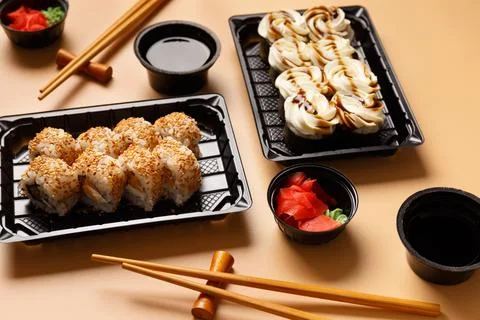 Sushi rolls in a package on a light background. Foto stock