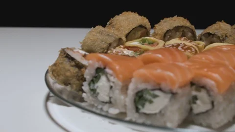 Sushi rolls on a plate side view camera moves from left to right Stock Footage 108009520