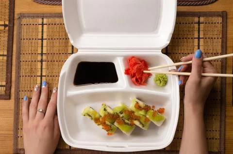 Sushi rolls with salmon caviar and kiwi Stock Photos