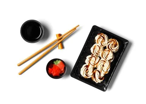 Sushi rolls with salmon, decorated with cream cheese in plastic packaging o.. Foto stock