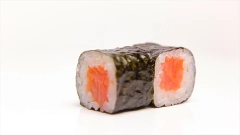 Sushi rolls with salmon rotating isolated on white Stock Footage