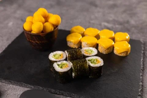 Sushi rolls set on dark background. Japanese and asian food concept Stock Photos