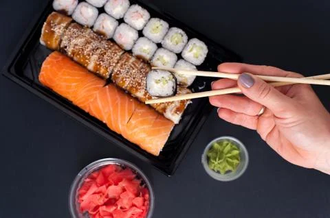 Sushi rolls set with wasabi, ginger and chopsticks Stock Photos