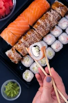 Sushi rolls set with wasabi, ginger and chopsticks Stock Photos
