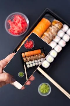 Sushi rolls set with wasabi, ginger and chopsticks Stock Photos
