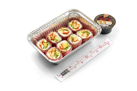 Sushi rolls with shrimp and avocado in a plate on a white background. Close-u Stock Photos