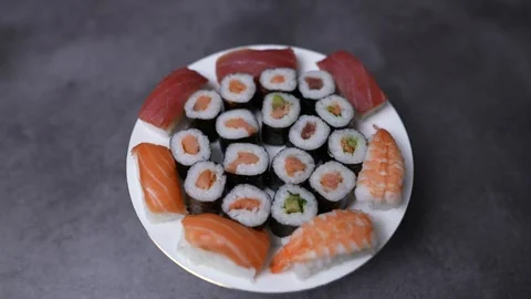 Sushi rotating on a plate in the kitchen Stock Footage 249933916