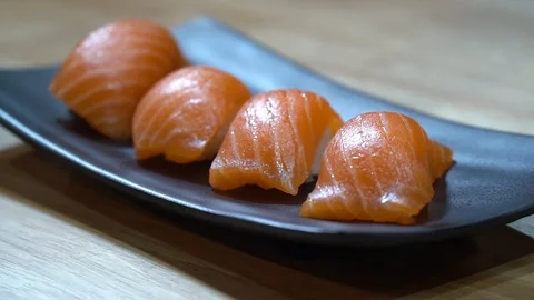 Sushi salmon on disk Stock Footage 128609558