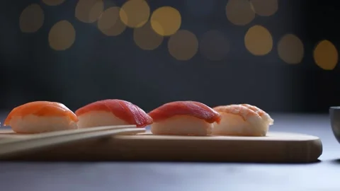 Sushi served on a table in a pan shot Stock Footage 249933525