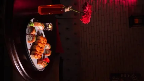 Sushi set of baked rolls on table in restaurant Stock Footage 269549059