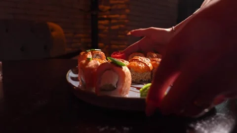 Sushi set of baked rolls on table in restaurant 스톡 동영상 269558847