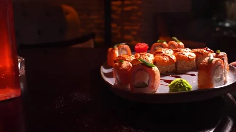 Sushi set of baked rolls on table in restaurant 스톡 동영상 269563241