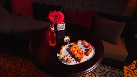 Sushi set of baked rolls on table in restaurant Vídeo Stock 269570183
