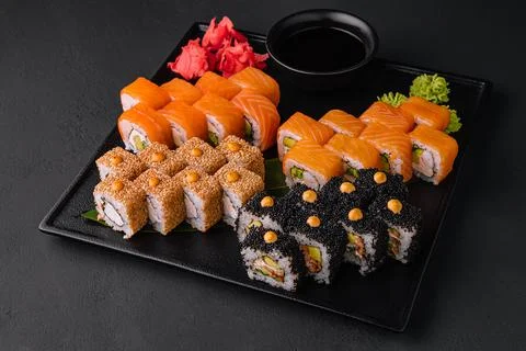 Assortment of Sushi Roll Set on a Black Tray. Japanese Food Stock