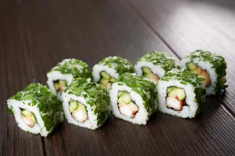 Sushi set on a dark brown table Stock Photos