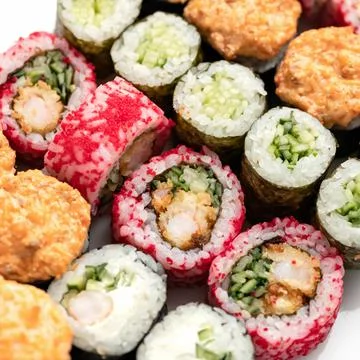 Sushi Set. Different types of raw and baked sushi rolls. Asian or Japanese food Stock Photos