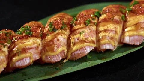 Sushi is spinning in a black container close-up. Stock Footage 239101465