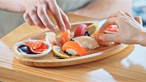 Sushi taken by hands Stock Footage 89651644