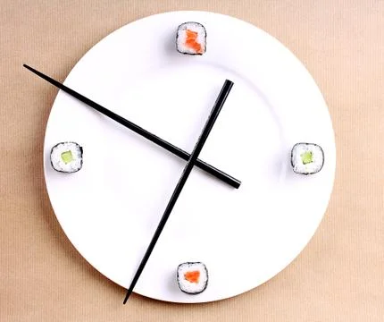 Sushi time in the form of a wall clock Stock Photos