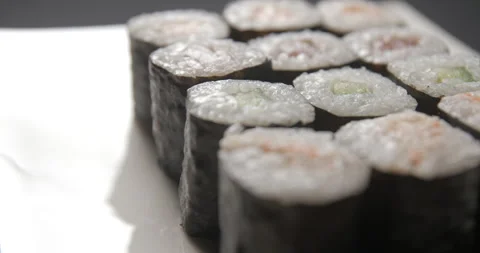Sushis rotating close ups on black background 4K Stock Footage 260137578