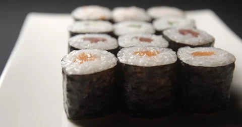 Sushis rotating close ups on black background 4K Stock Footage 260137657