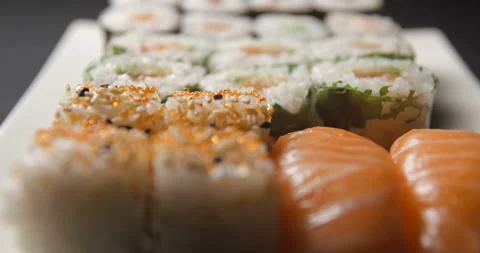 Sushis rotating close ups on black background 4K Stock Footage 260137757