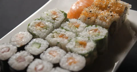Sushis rotating close ups on black background 4K Stock Footage 260137820