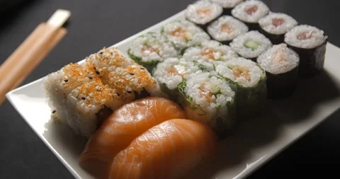 Sushis rotating close ups on black background 4K Stock Footage 260137859