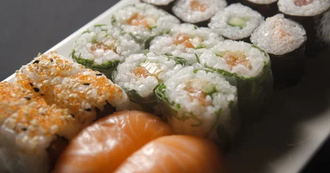 Sushis rotating close ups on black background 4K Stock Footage 260137865