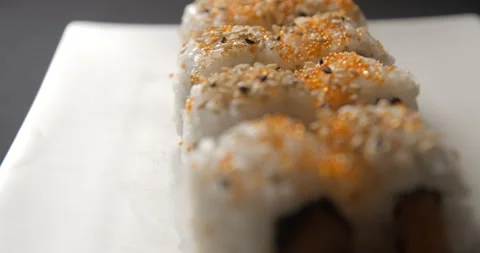Sushis rotating close ups on black background 4K Video stock 260138115