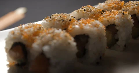 Sushis rotating close ups on black background 4K Video stock 260138229