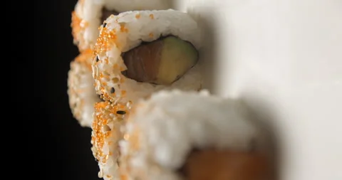 Sushis rotating close ups on black background 4K Video stock 260138233