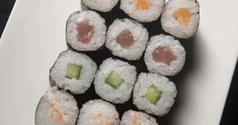 Sushis rotating close ups on black background 4K Video stock 260138345