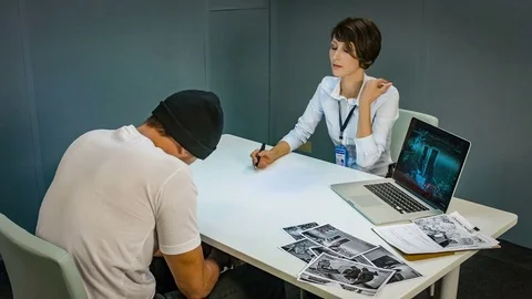 Suspect offender is present in the interrogation and wrote testimony 스톡 동영상 69954045