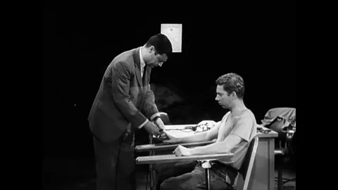 The suspect in a robbery still attempts to deny his crimes to an Examiner even Stock Footage 126048707
