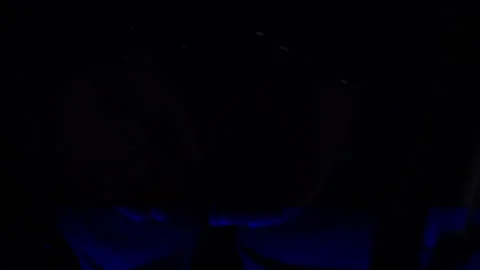 A suspect&amp;#039;s handcuffed hands under flashing police lights during arrest Stock Footage 318835296