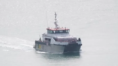 Suspected migrants arrive at Dover Stock Footage 314565273