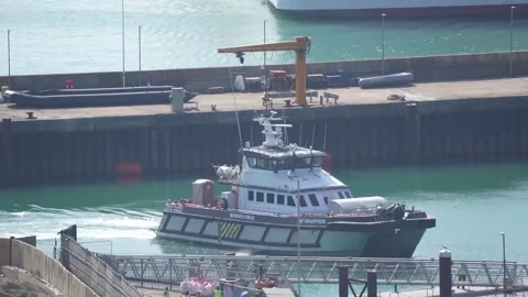 Suspected migrants brought in by Border Security Command after small boat incid Stock Footage 340459652