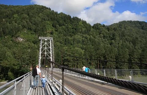 Suspended bridge through Katun. Stock Photos