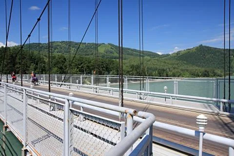 Suspended bridge through Katun. Stock Photos