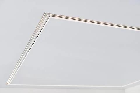 Suspended ceiling with LED strip lamp in empty room, repair Stock Photos