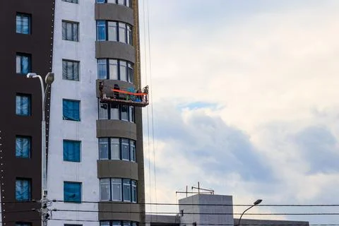 Suspended platform or cradle for construction, installation and repair work Stock Photos